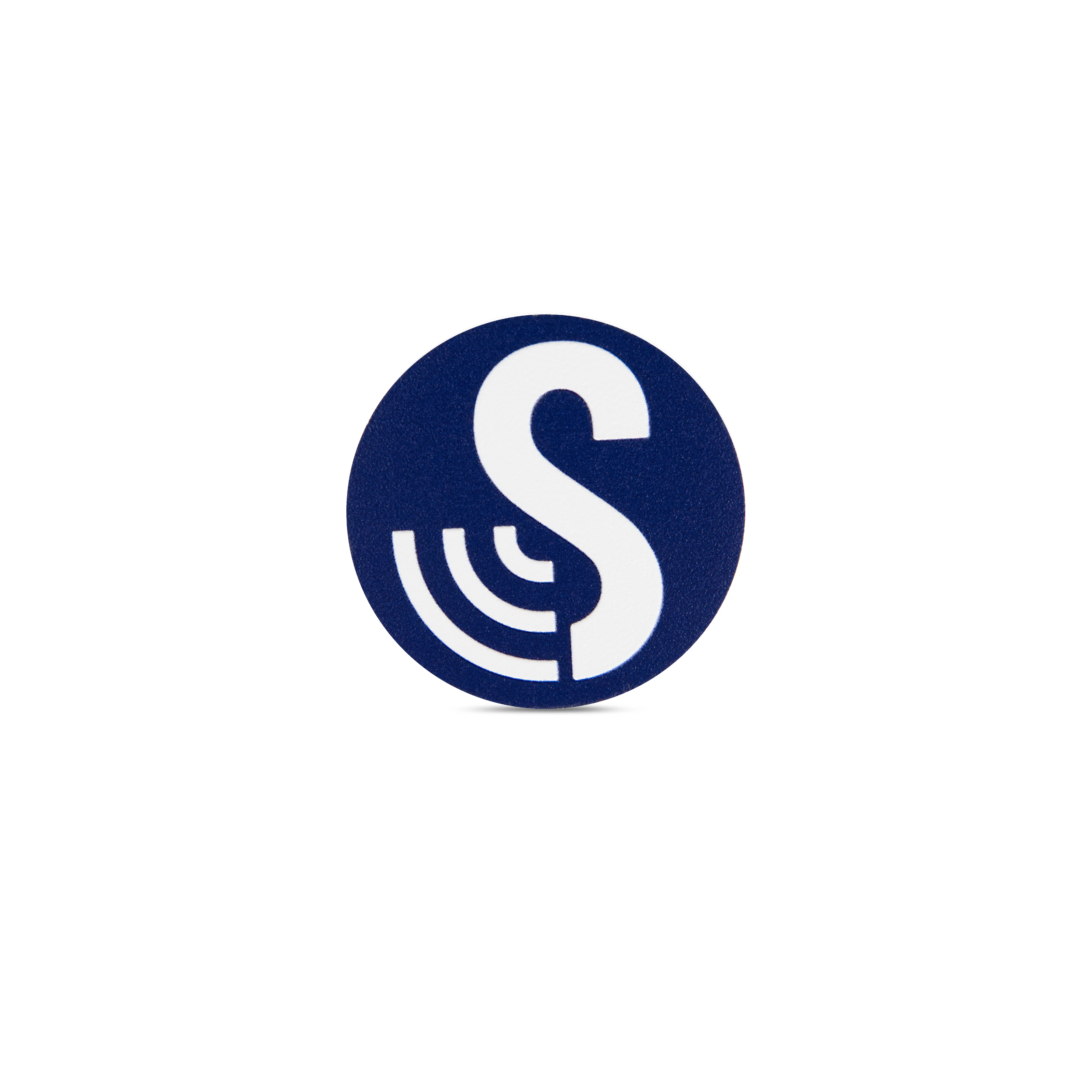 Front view of the waterproof round SenseTap sticker. The sticker has a diameter of 40 mm. It is dark blue and features the SenseTap logo, which consists of a large white S with three curved lines extending to the left.